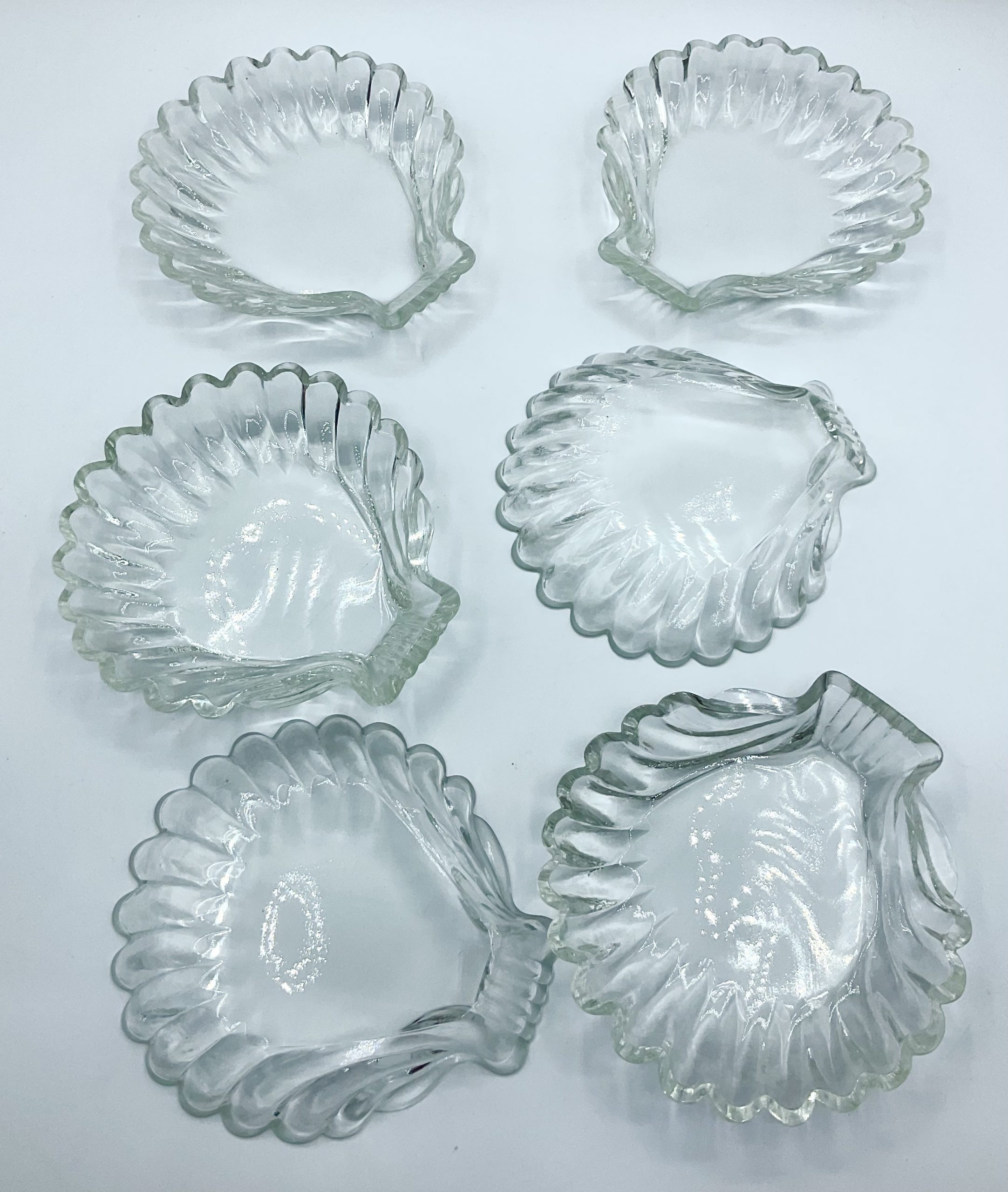 Old cut to clear scalloped shape dishes.